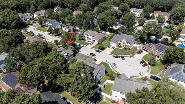 an aerial view of residential houses with outdoor space