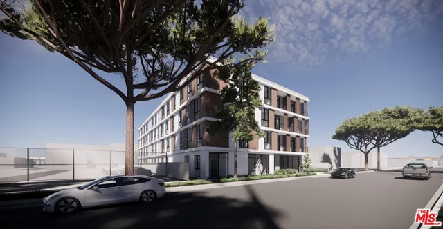 a city street lined with buildings and cars