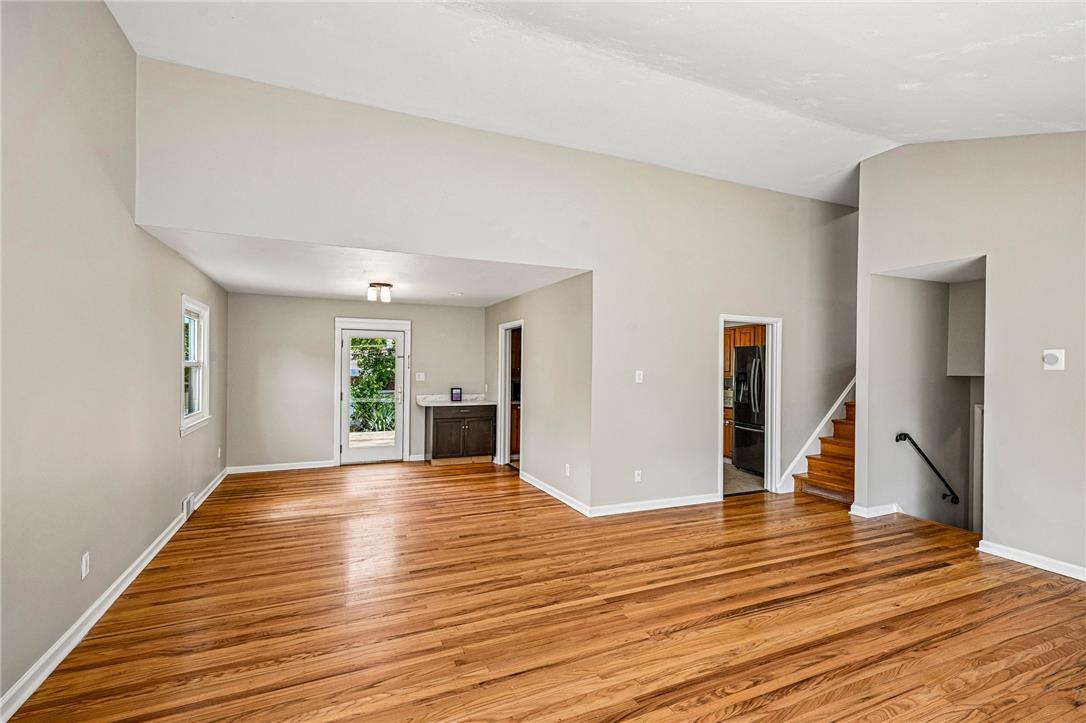 2428 Nottingham Road Bethlehem, PA 18017 - Photo 6 of 48 Natural wood floors extend through this open-concept living space with access to the outdoors.