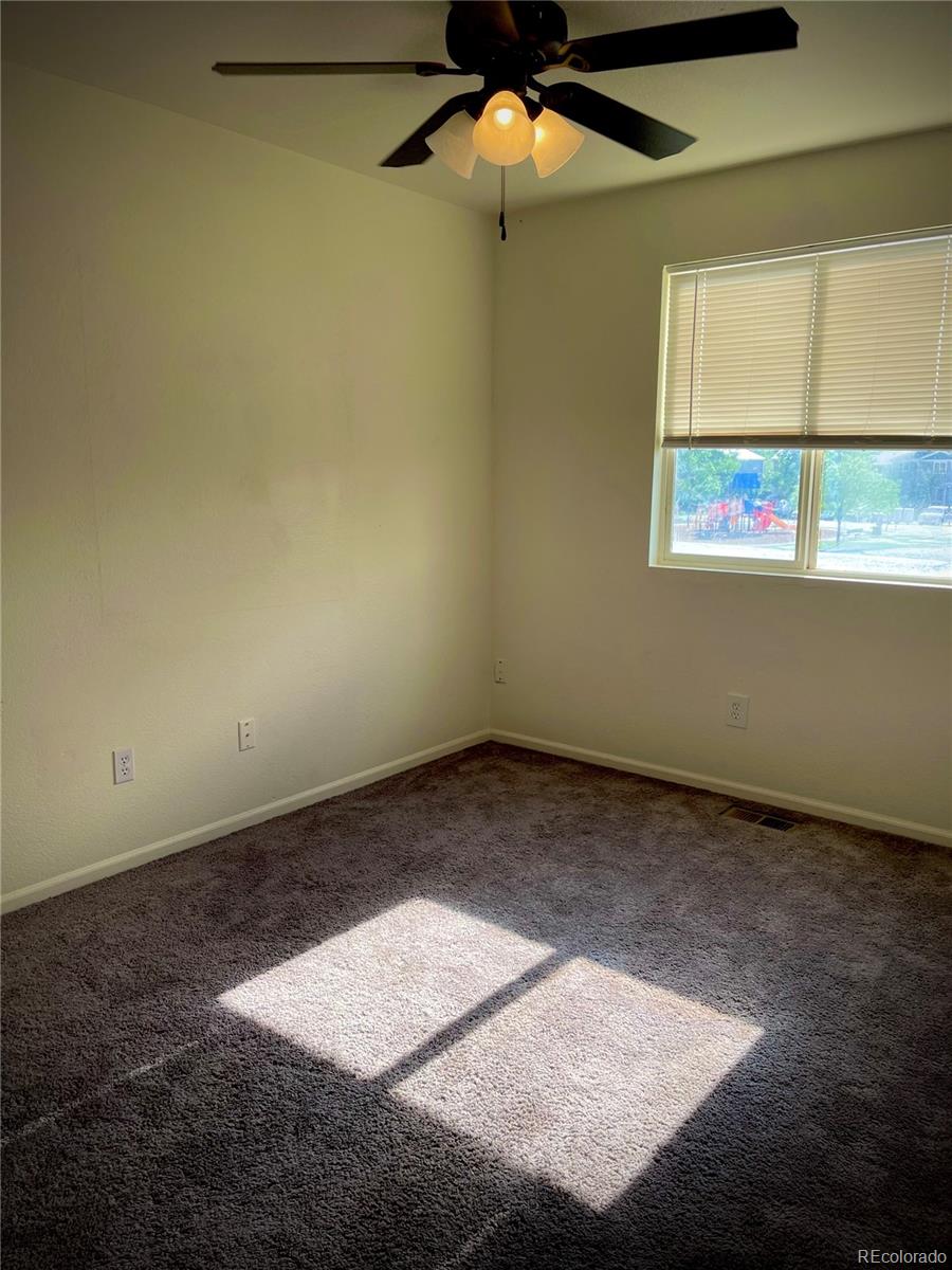 10100 Eudora Court Thornton, CO 80229 - Photo 14 of 17 an empty room with a window