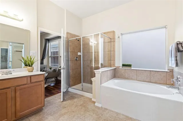 a bathroom with a bathtub and a sink