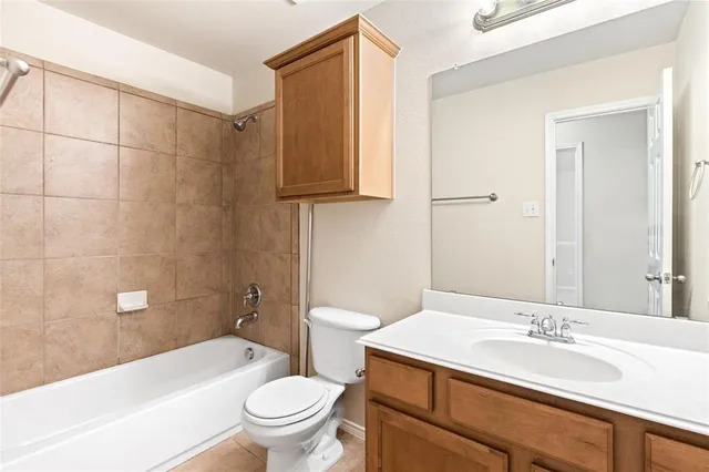 a bathroom with a sink a toilet and a bathtub