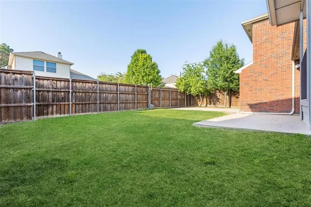 a view of a backyard with a garden