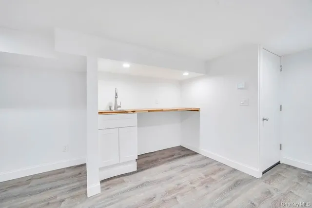 a view of cabinets and wooden floor