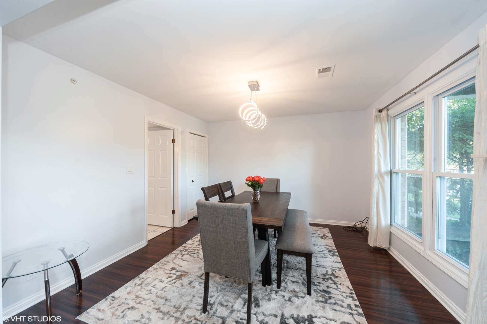 117 Rivershire Lane Lincolnshire, IL 60069 - Photo 4 of 19 a view of a dining room with furniture window and wooden floor
