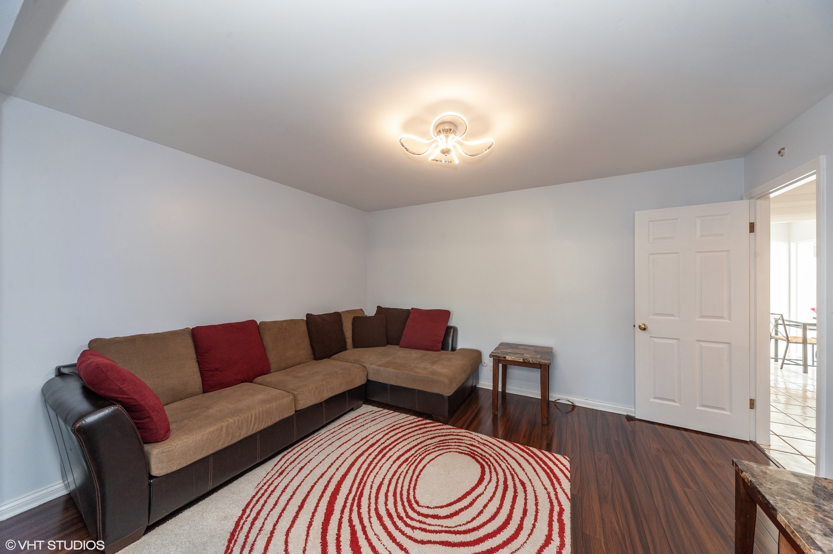 117 Rivershire Lane Lincolnshire, IL 60069 - Photo 6 of 19 a living room with furniture and a wooden floor