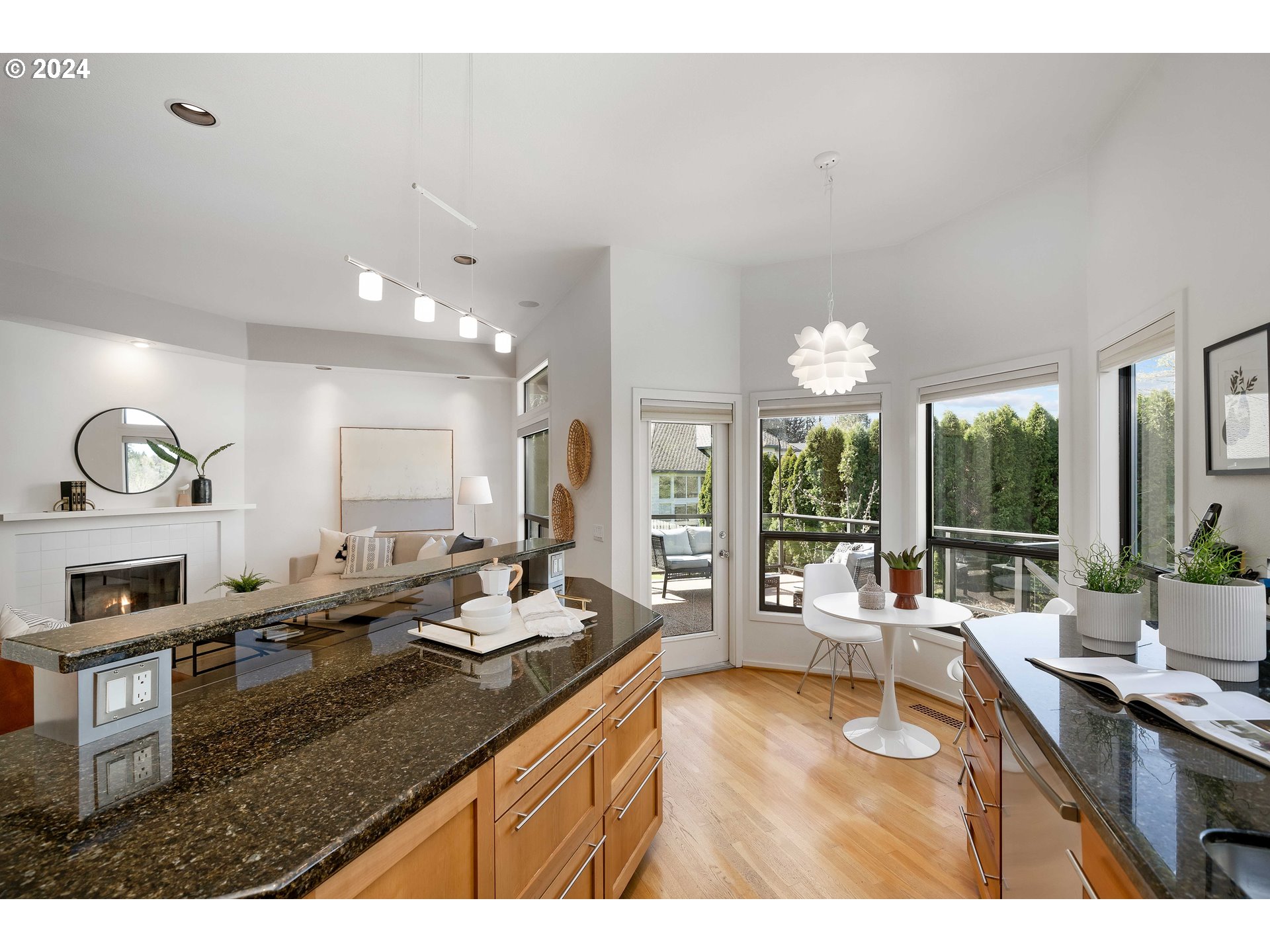 7179 Southwest Arranmore Way Portland, OR 97223 - Photo 14 of 48 a open kitchen with granite countertop a sink and cabinets