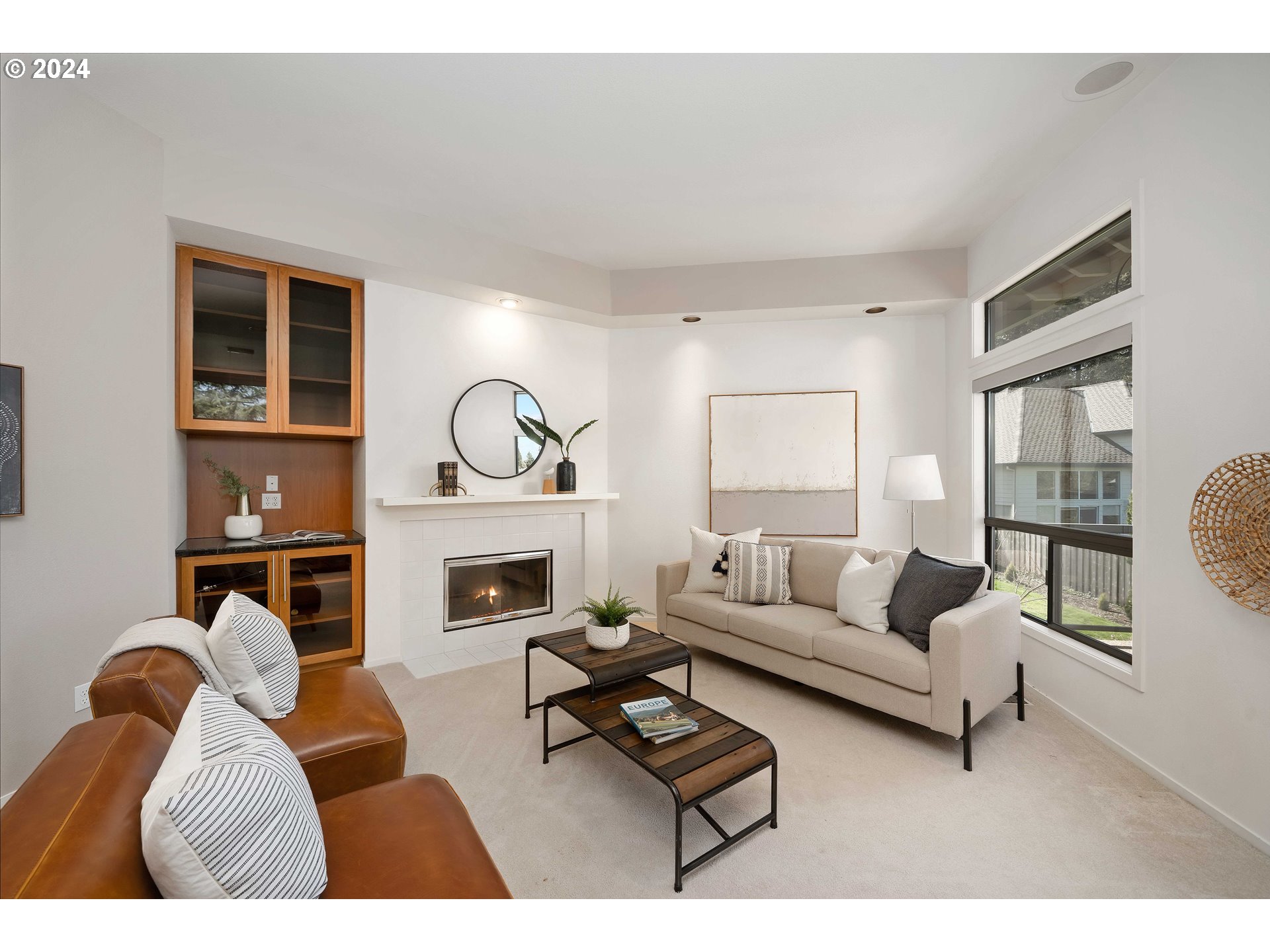 7179 Southwest Arranmore Way Portland, OR 97223 - Photo 18 of 48 a living room with furniture a fireplace and a window