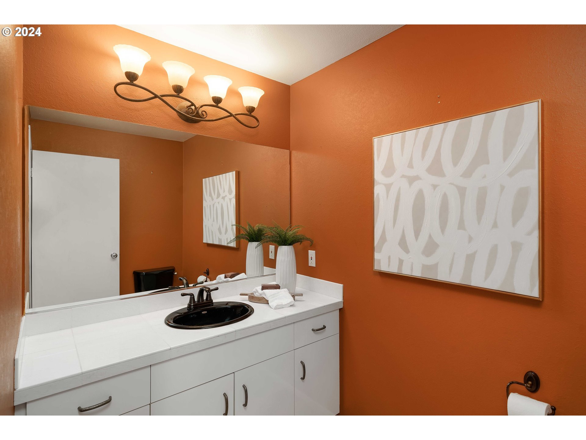 7179 Southwest Arranmore Way Portland, OR 97223 - Photo 23 of 48 a bathroom with a sink and a mirror