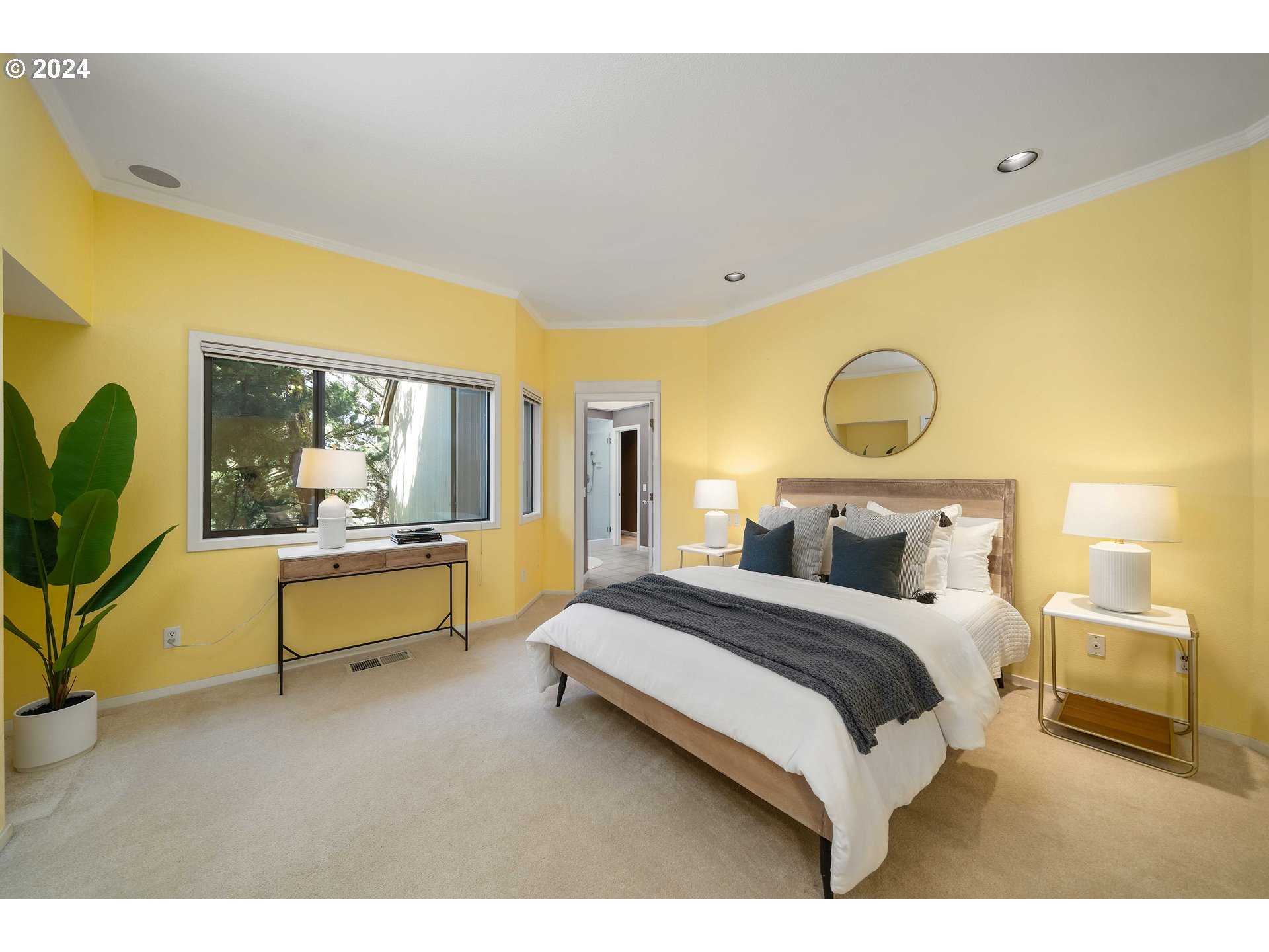 7179 Southwest Arranmore Way Portland, OR 97223 - Photo 24 of 48 a bedroom with a bed and a chandelier