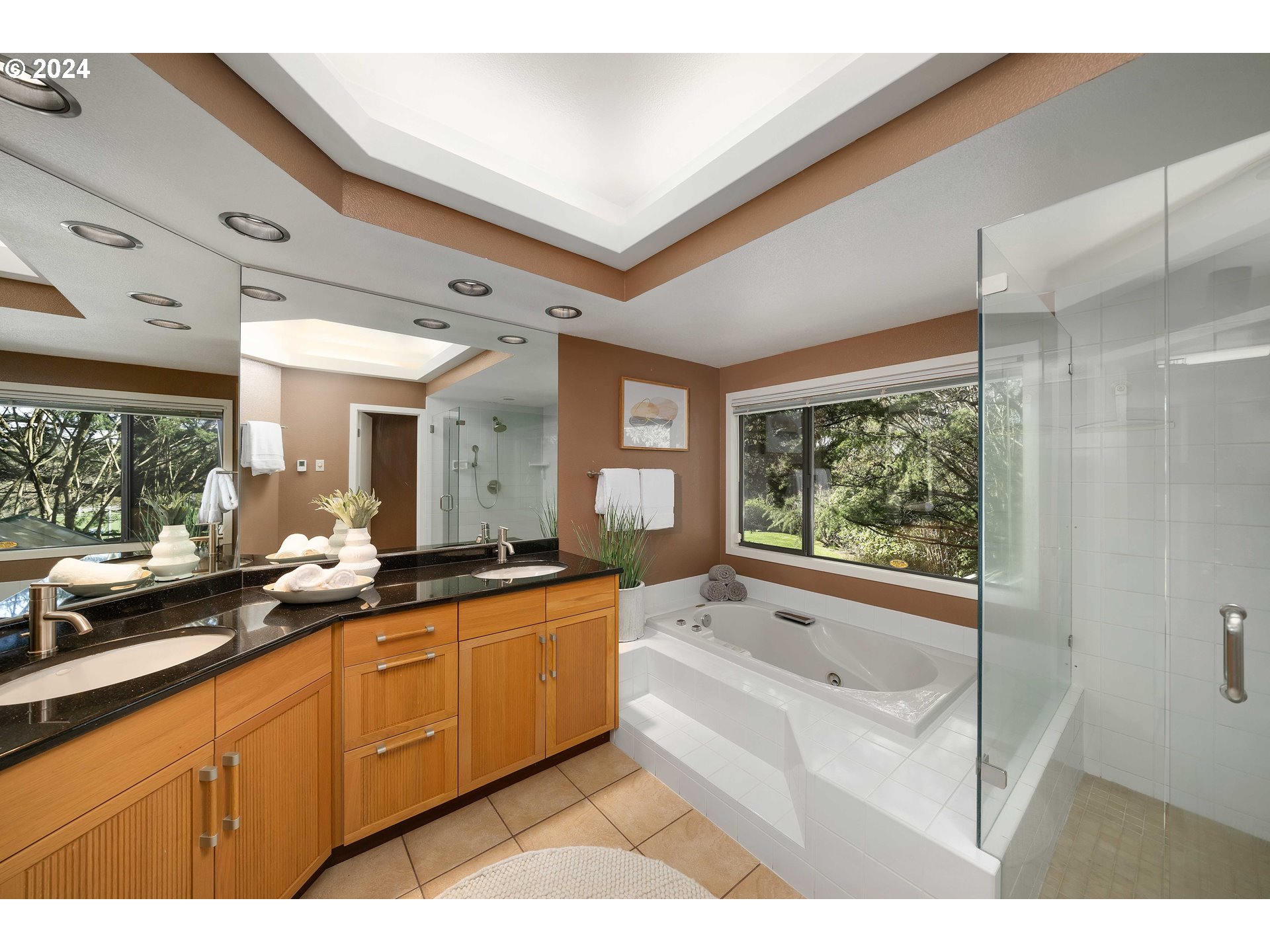 7179 Southwest Arranmore Way Portland, OR 97223 - Photo 25 of 48 a large white kitchen with a large window
