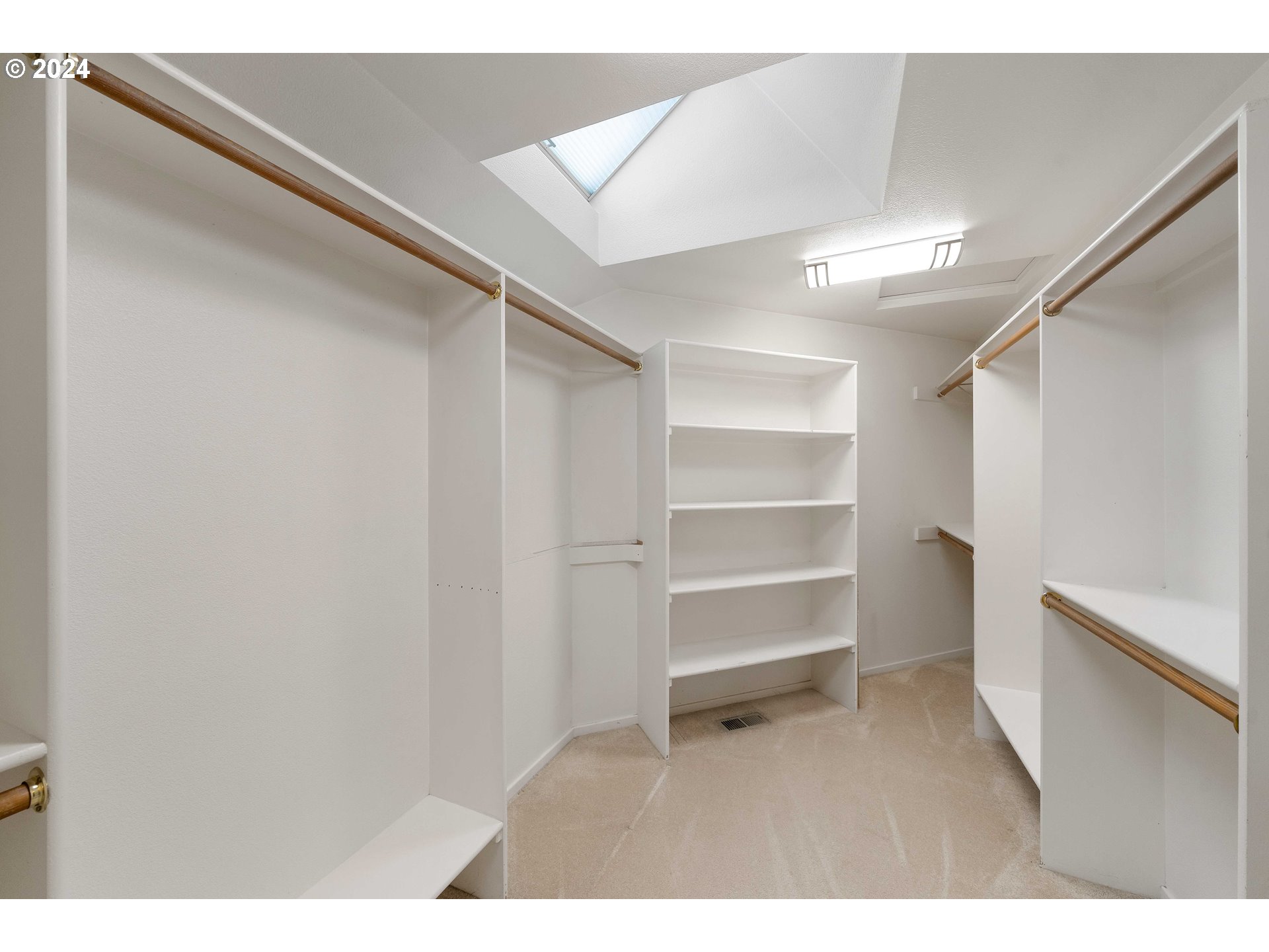 7179 Southwest Arranmore Way Portland, OR 97223 - Photo 26 of 48 a room with closet and wooden floor