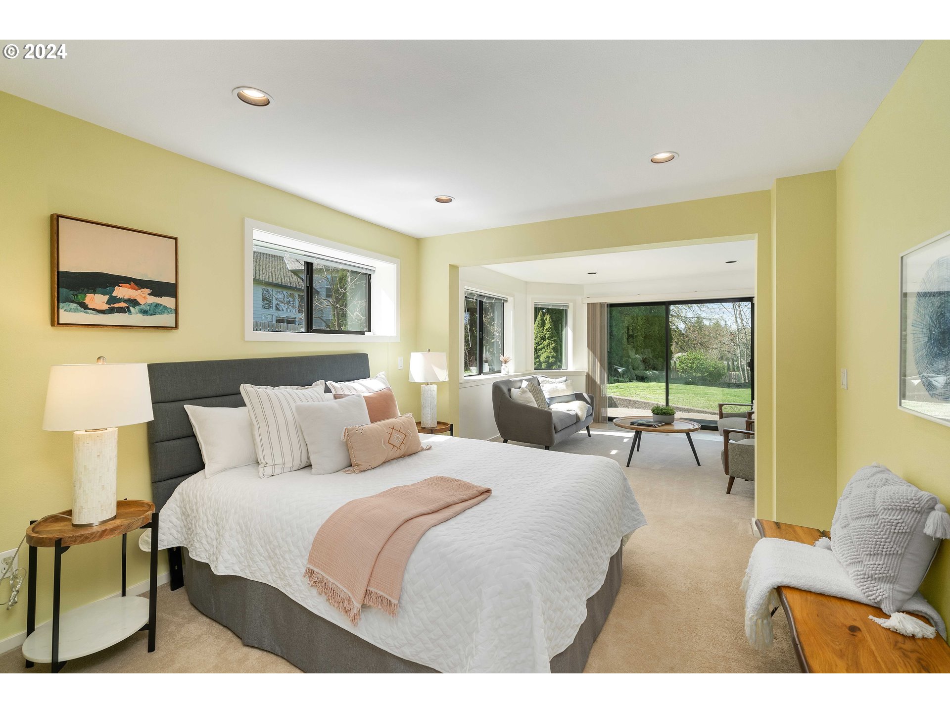 7179 Southwest Arranmore Way Portland, OR 97223 - Photo 30 of 48 a bedroom with a bed and glass windows