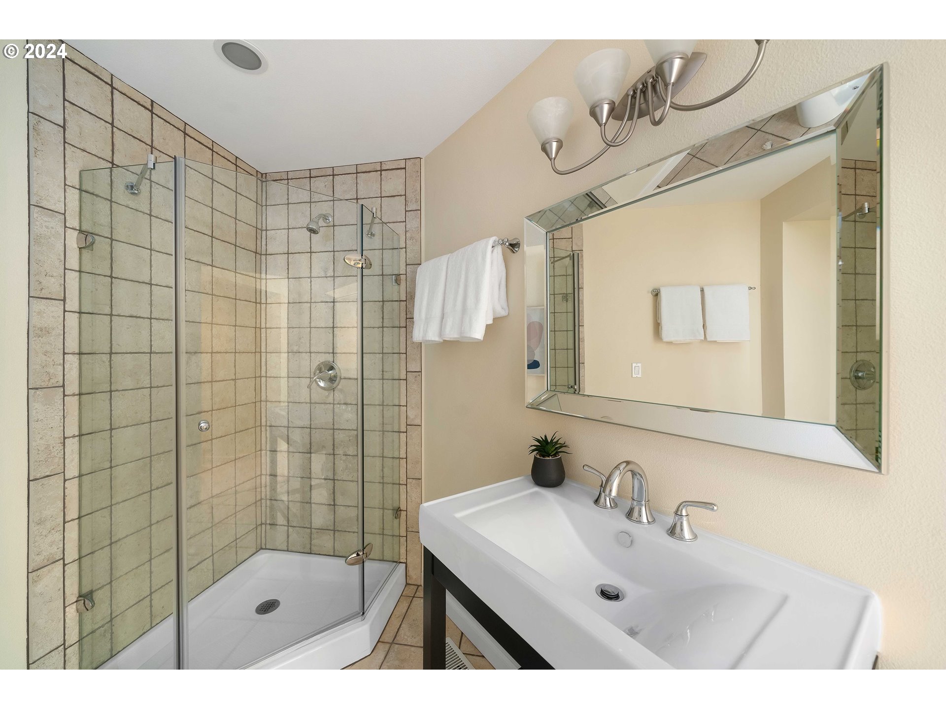 7179 Southwest Arranmore Way Portland, OR 97223 - Photo 34 of 48 a bathroom with a sink a mirror and a shower
