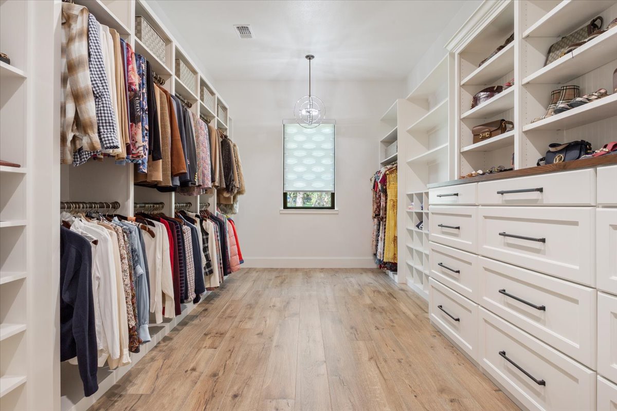 309 Highland Spring Lane Georgetown, TX 78633 - Photo 27 of 40 This is THE best closet off of the Primary Bathroom. Complete with dresser drawers, built-in shelves for your shoes, purses, whatever you store...PLUS your hang up clothes...