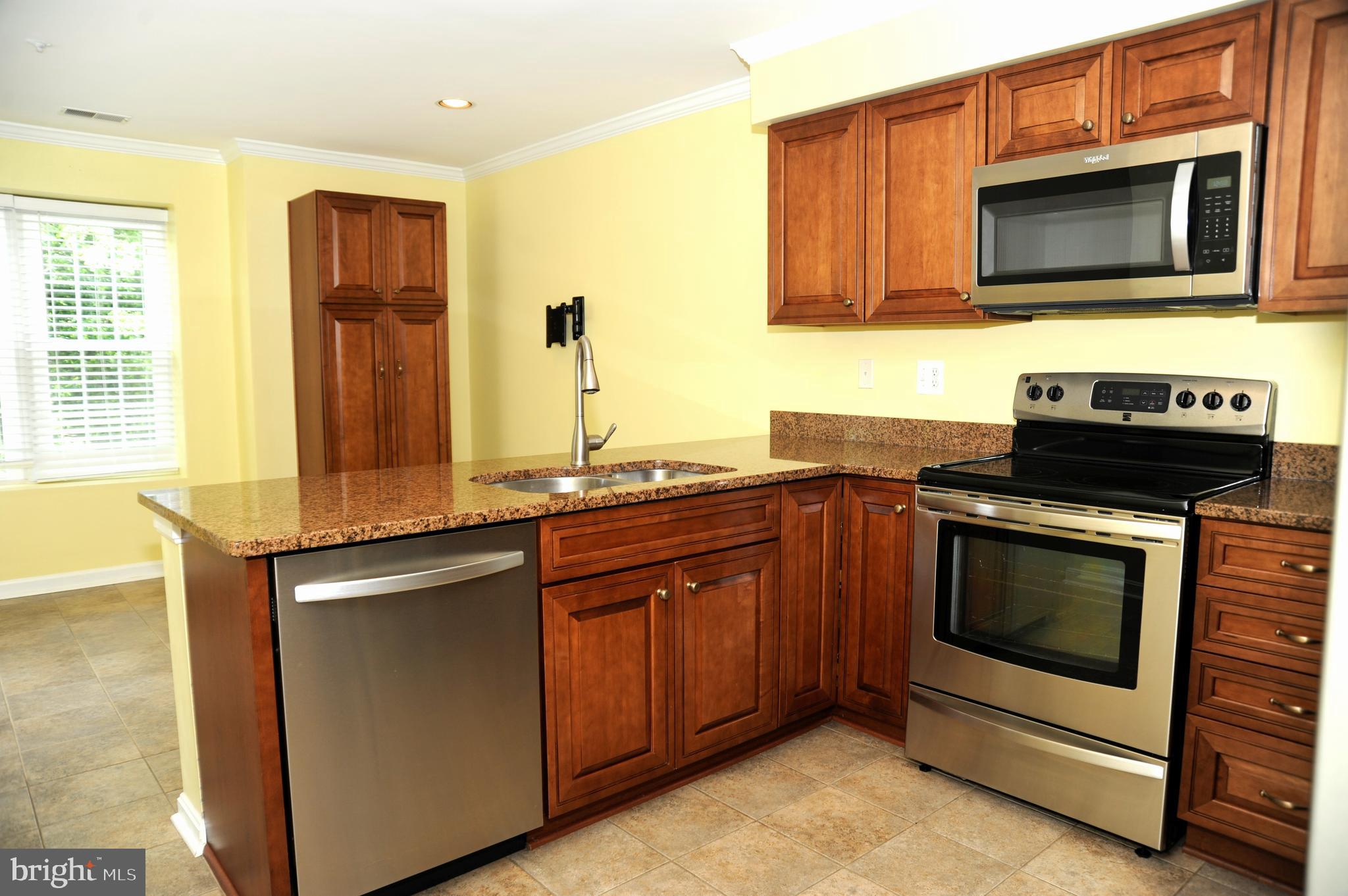 12320 Rosslare Ridge Road, Unit 207 Lutherville-Timonium, MD 21093 - Photo 13 of 30 Handsome kitchen with stainless appliances