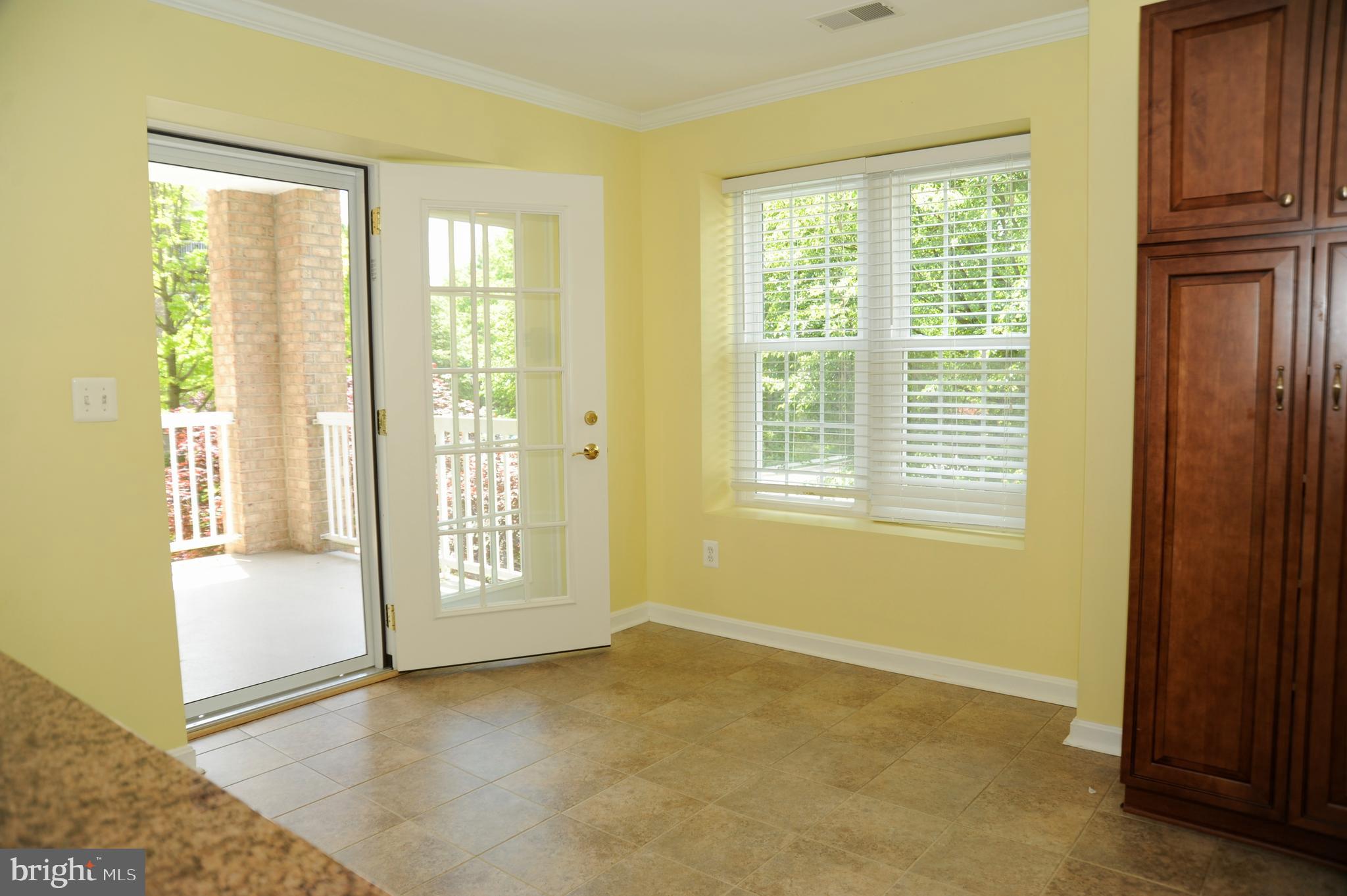 12320 Rosslare Ridge Road, Unit 207 Lutherville-Timonium, MD 21093 - Photo 16 of 30 Informal eating area with exit to large balcony!