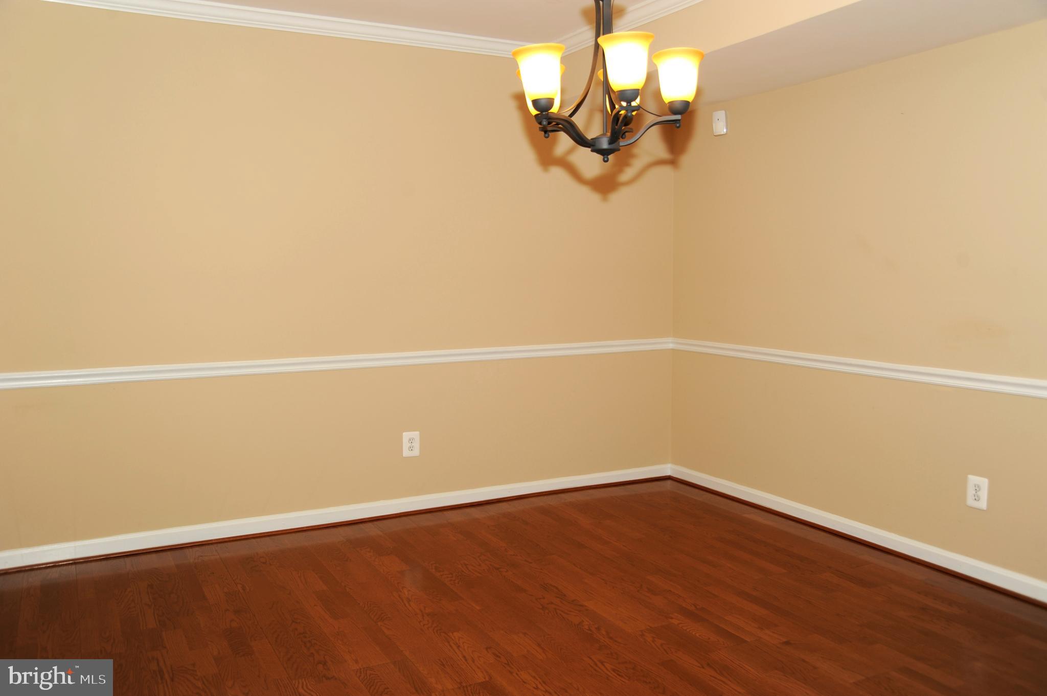 12320 Rosslare Ridge Road, Unit 207 Lutherville-Timonium, MD 21093 - Photo 9 of 30 Formal dining area - gleaming wood floors!