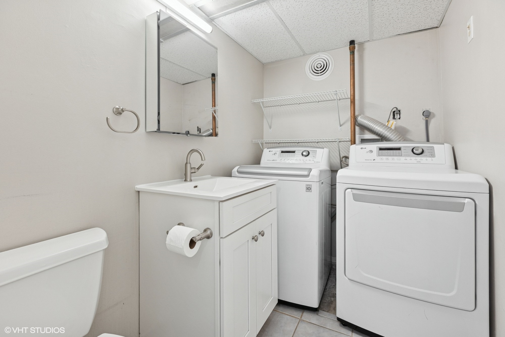 534 West Brompton Avenue, Unit 1N Chicago, IL 60657 - Photo 17 of 20 a bathroom with a sink a toilet and a mirror