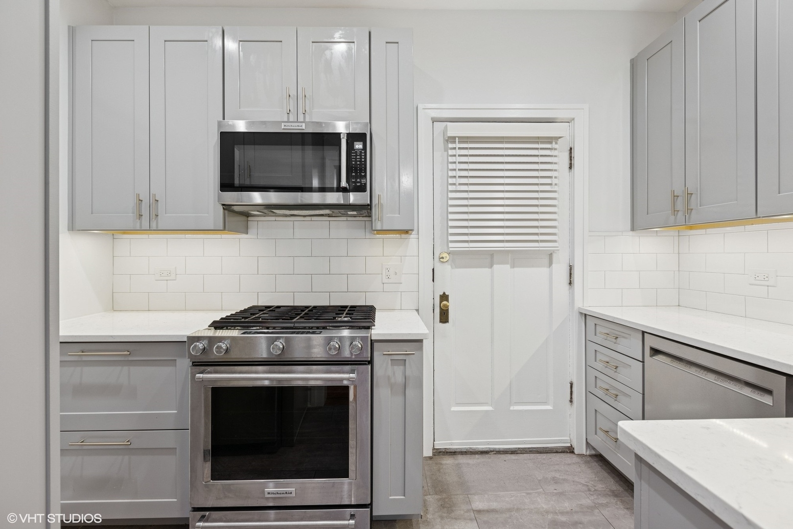 534 West Brompton Avenue, Unit 1N Chicago, IL 60657 - Photo 5 of 20 a kitchen with stainless steel appliances wooden cabinets and a stove top oven