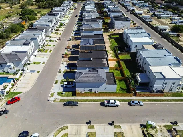 an aerial view of a house with roof deck and outdoor seating