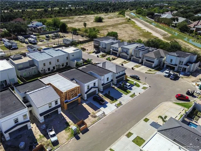 an aerial view of a house with a lake view
