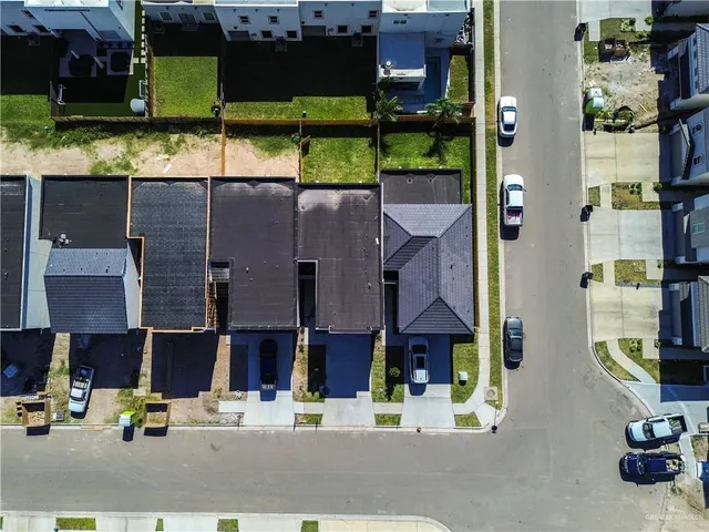 an aerial view of a house with a lake view