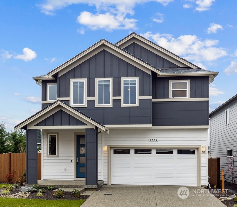 4020 171st Place Southeast Bothell, WA 98012 - Photo 1 of 35 a front view of a house with yard