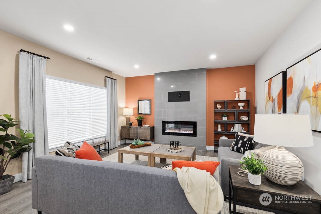 4020 171st Place Southeast Bothell, WA 98012 - Photo 12 of 35 a living room with fireplace furniture and a flat screen tv