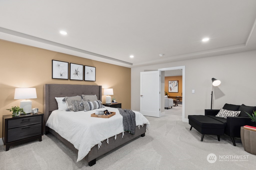 4020 171st Place Southeast Bothell, WA 98012 - Photo 17 of 35 a spacious bedroom with a bed and a couch