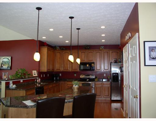 4236 Clendenning Road Gibsonia, PA 15044 - Photo 5 of 14 Kitchen. Granite countertops. Stainless steel electric stove with double ovens, microwave, and stainless steel refrigerator are included. Hardwood floors sparkle.