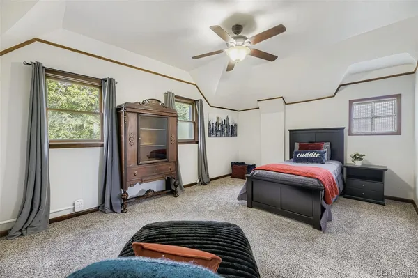 a bedroom with bed and a window