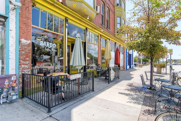 a view of a building with outdoor seating