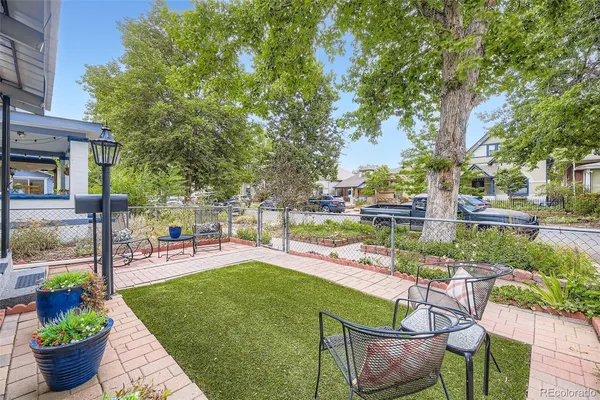 a view of a backyard with sitting area and furniture