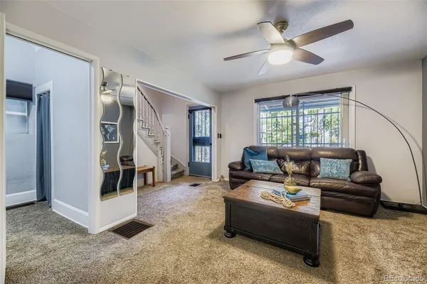 a living room with furniture and a window