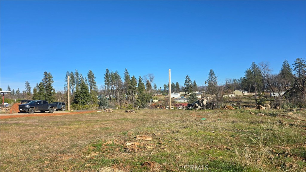 5619 Sawmill Road Paradise, CA 95969 - Photo 15 of 19 a view of a field with trees in the background