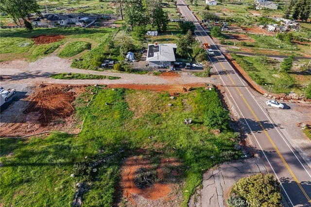 an aerial view of residential house with outdoor space and lake view