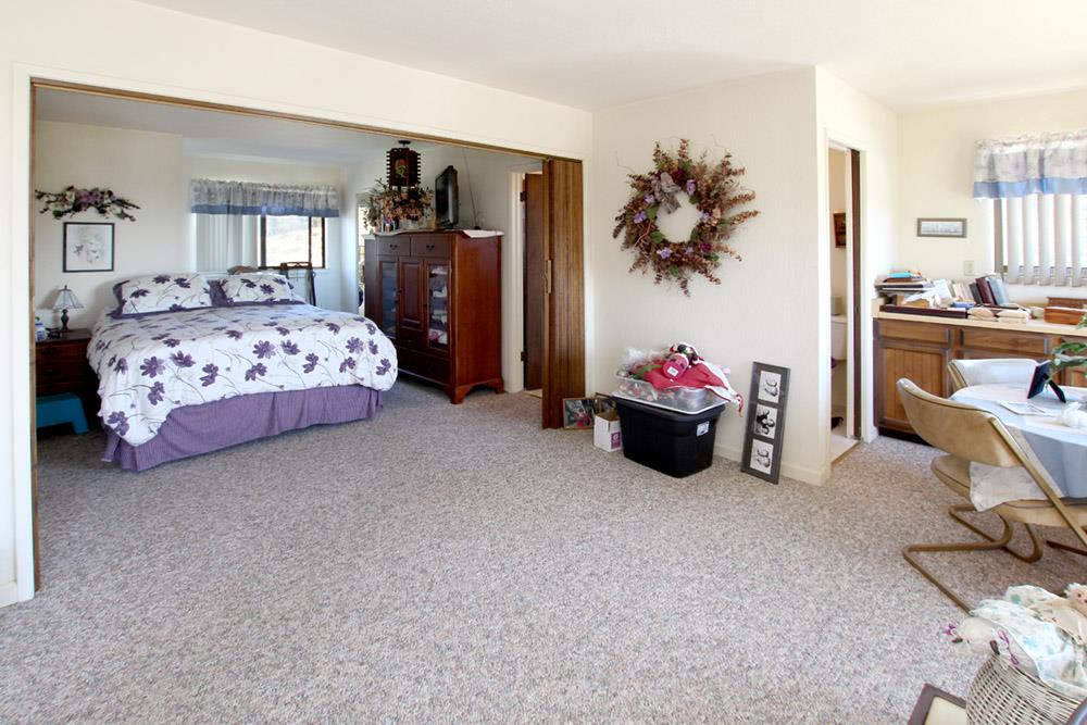 53 Valley View Road Watsonville, CA 95076 - Photo 14 of 38 a bedroom with a bed and a couch