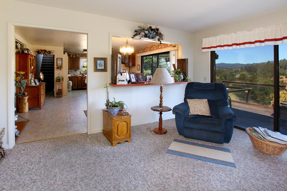 53 Valley View Road Watsonville, CA 95076 - Photo 15 of 38 a living room with furniture and a floor to ceiling window