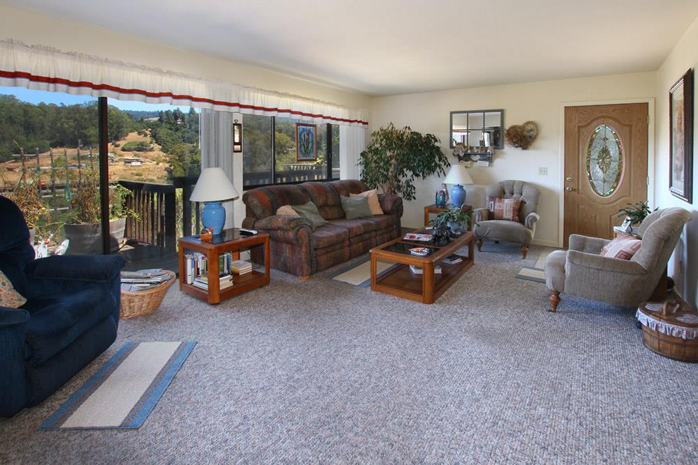 53 Valley View Road Watsonville, CA 95076 - Photo 7 of 38 a living room with furniture and a floor to ceiling window