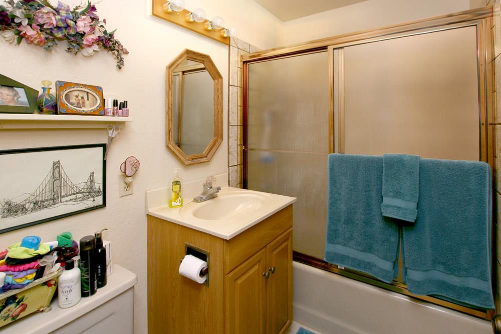 53 Valley View Road Watsonville, CA 95076 - Photo 8 of 38 a bathroom with a sink mirror and vanity