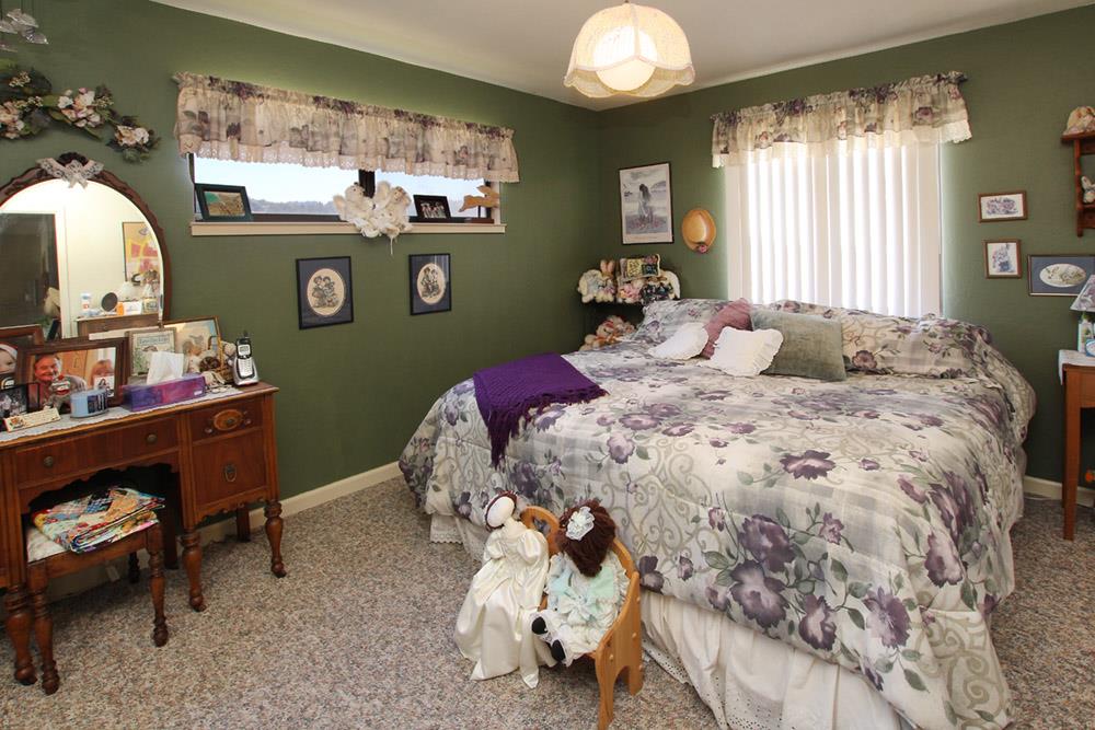 53 Valley View Road Watsonville, CA 95076 - Photo 10 of 38 a bedroom with a bed and a mirror on the dresser