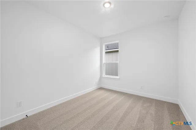 a bathroom with a granite countertop sink a toilet and bathtub