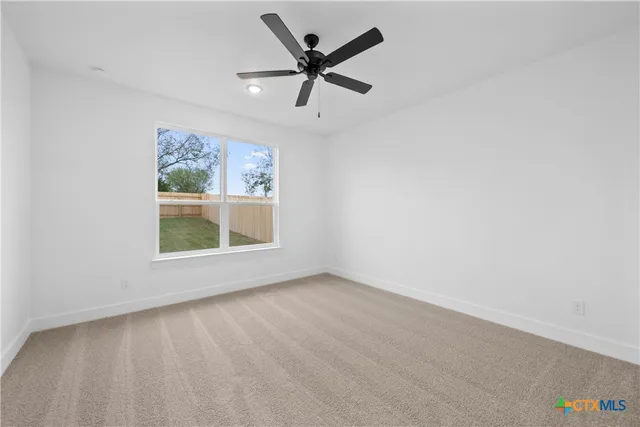 a kitchen with stainless steel appliances granite countertop a sink a stove a refrigerator and island with wooden floor