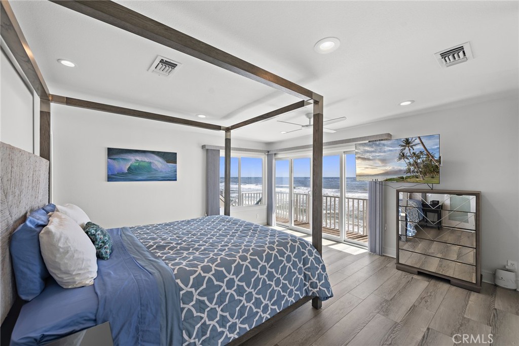 35585 Beach Road Dana Point, CA 92624 - Photo 22 of 43 a bedroom with a large bed and a window