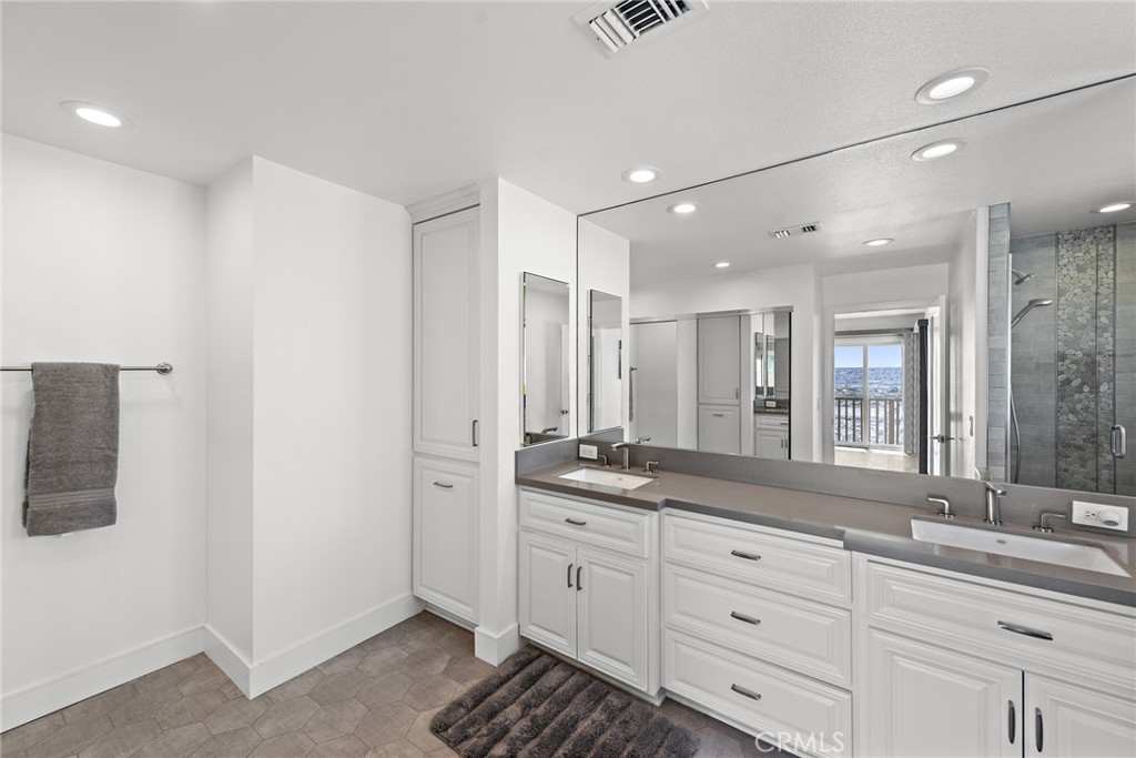 35585 Beach Road Dana Point, CA 92624 - Photo 27 of 43 a spacious bathroom with a granite countertop sink mirror and double