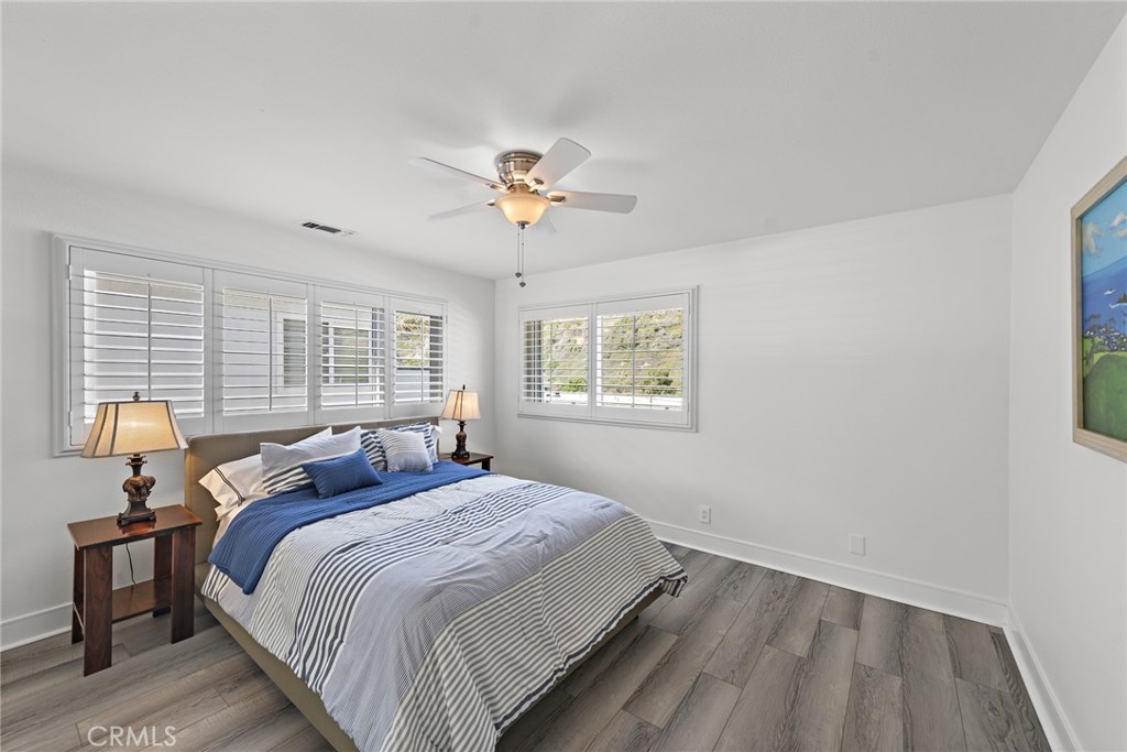 35585 Beach Road Dana Point, CA 92624 - Photo 29 of 43 a bedroom with a bed and a window