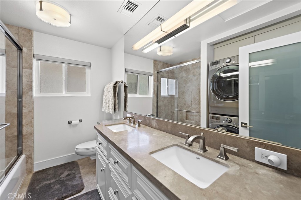 35585 Beach Road Dana Point, CA 92624 - Photo 30 of 43 a bathroom with 2 sink and a mirror