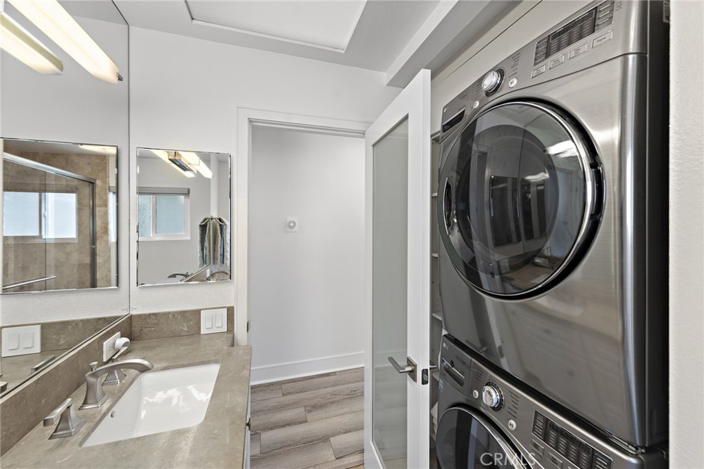 35585 Beach Road Dana Point, CA 92624 - Photo 31 of 43 a bathroom with a sink a mirror and a shower