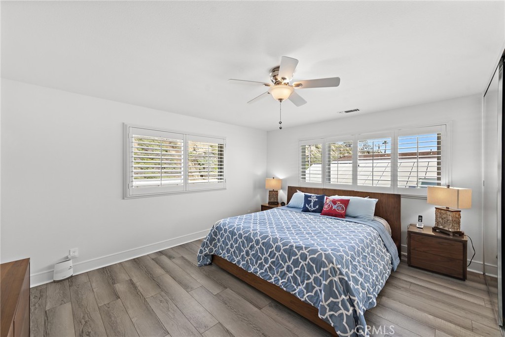 35585 Beach Road Dana Point, CA 92624 - Photo 32 of 43 a bedroom with a large bed and a window